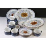 Denby mottled blue glazed tea ware to include 6 teacups, 7 saucers and a milk jug, together with 7