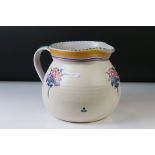 Poole Pottery Carter Stabler Adams Ltd jug with polychrome floral motifs and banding to the upper
