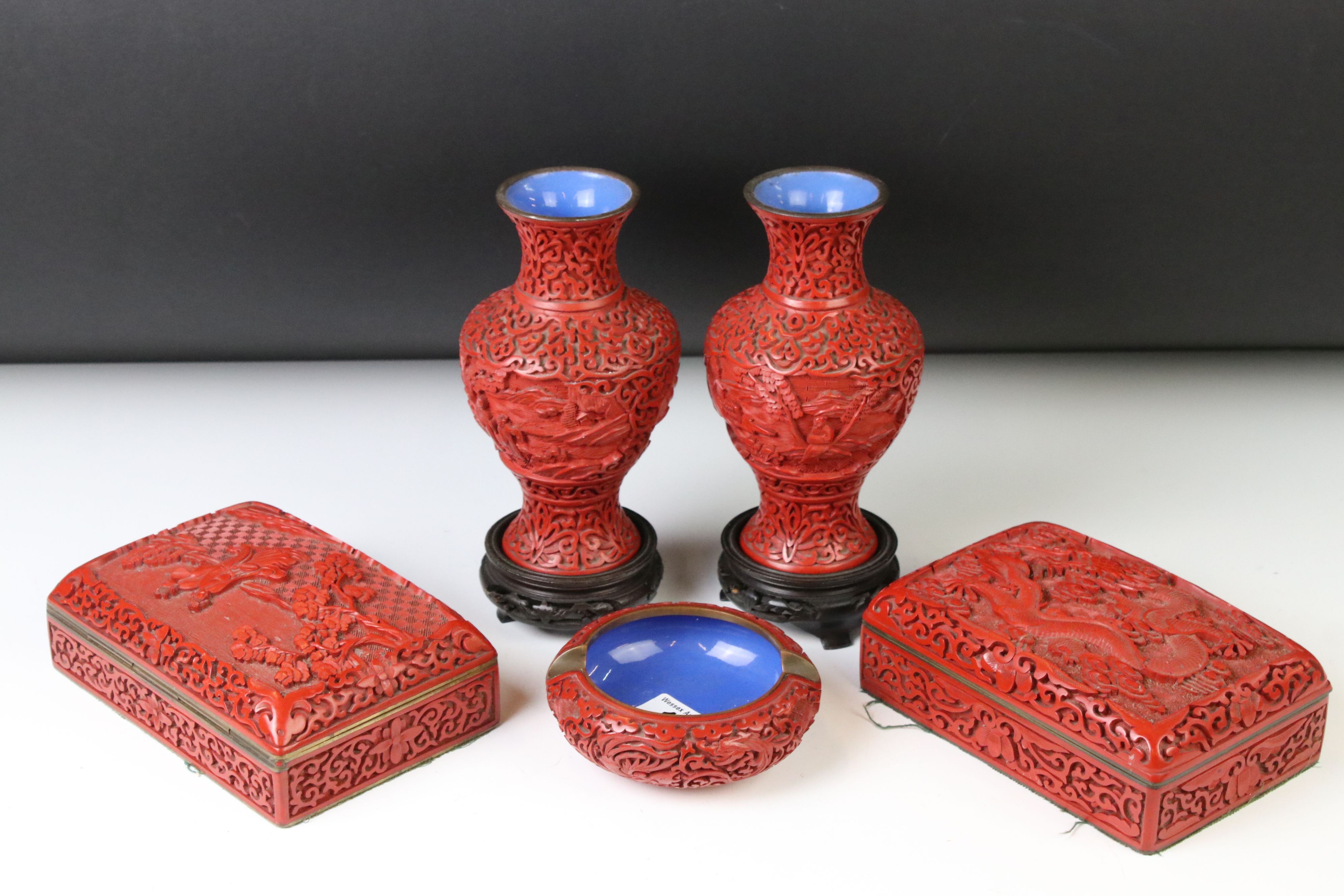 Five pieces of 20th century Chinese cinnabar lacquer ware comprising a pair of baluster vases