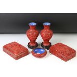 Five pieces of 20th century Chinese cinnabar lacquer ware comprising a pair of baluster vases