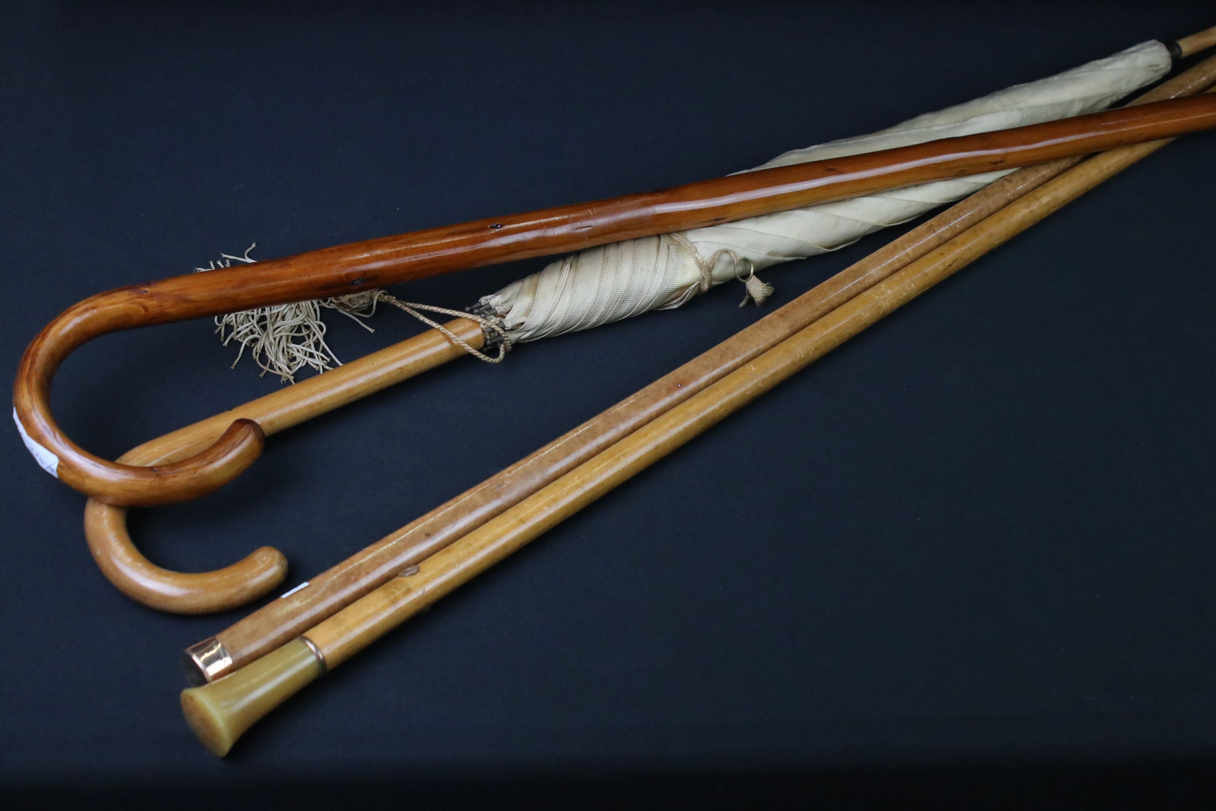 Malacca gold topped walking cane, another Malacca cane with horn handle, one other cane & a