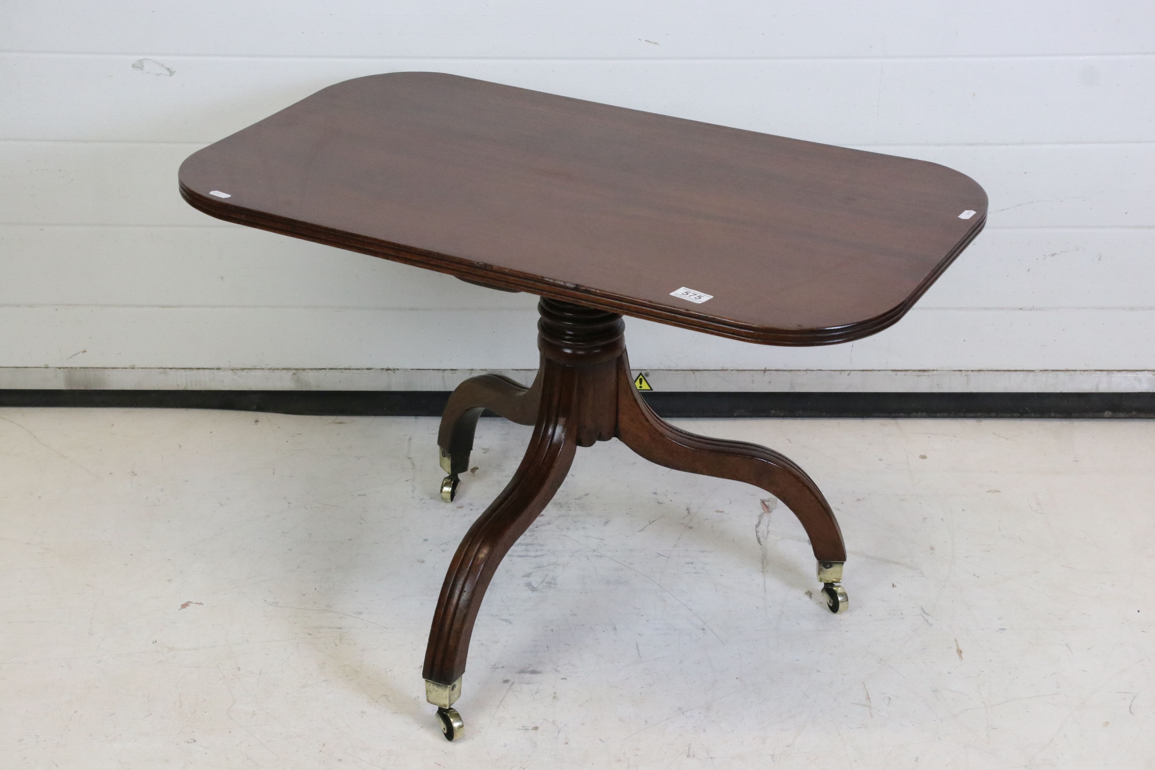 19th century Mahogany Rectangular Low Table raised on a turned column and three splay legs with