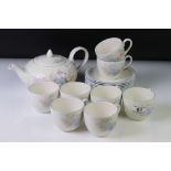 Poole Pottery teapot & eight cups and saucers from the Fleur range