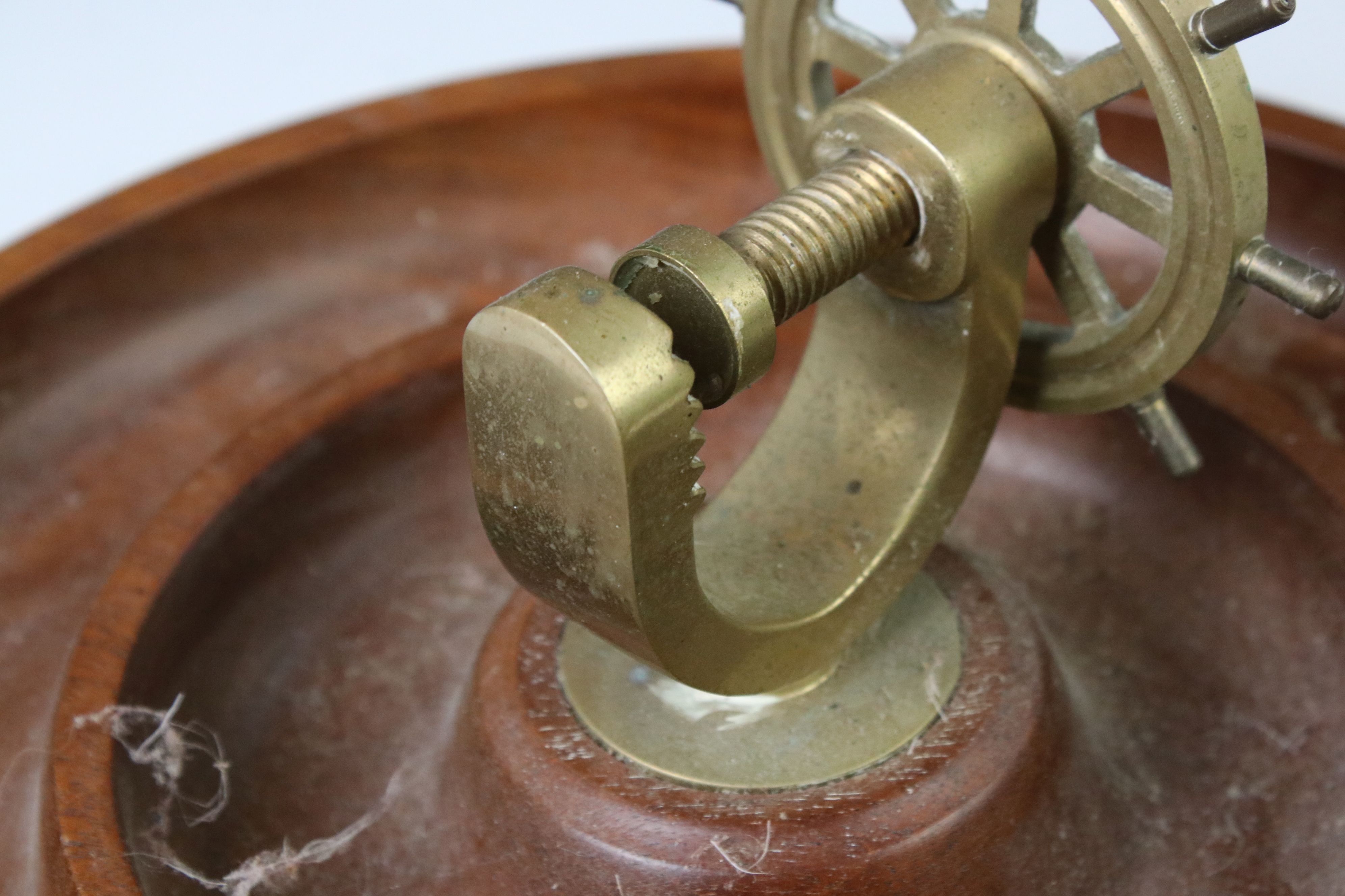 Novelty turned wooden nut dish mounted with a brass ship's wheel nutcracker, approx 29cm diameter - Image 2 of 3