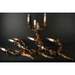 Set of Four Gilt Metal Foliate Scrolling Three Branch Wall Electric Lights in the rococo manner,