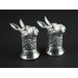 Pair of condiments in the form of hares, stamped 800 to the underside