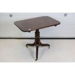 19th century Rectangular Mahogany Side Table raised on a turned pedestal and three splay legs