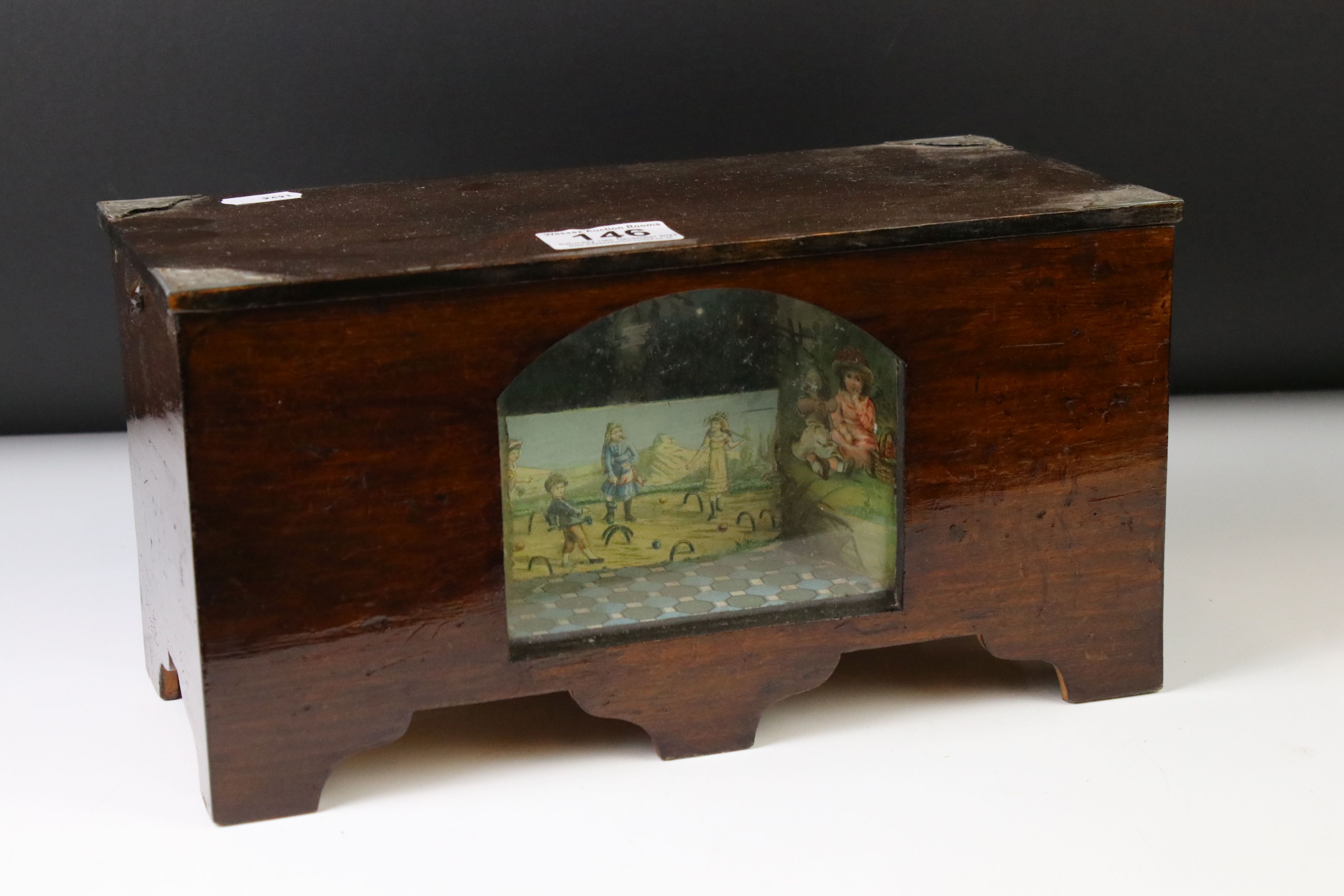 Novelty stained pine music box, with an arched glass panel to the front enclosing a