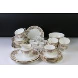 E. Hughes & Co china tea ware with floral and Greek key style decoration, comprising 9 teacups, 12