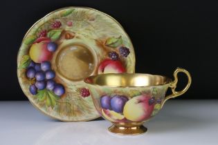 Aynsley Orchard Gold tea cup and saucer, the teacup with gilt interior and foot rim, the saucer with