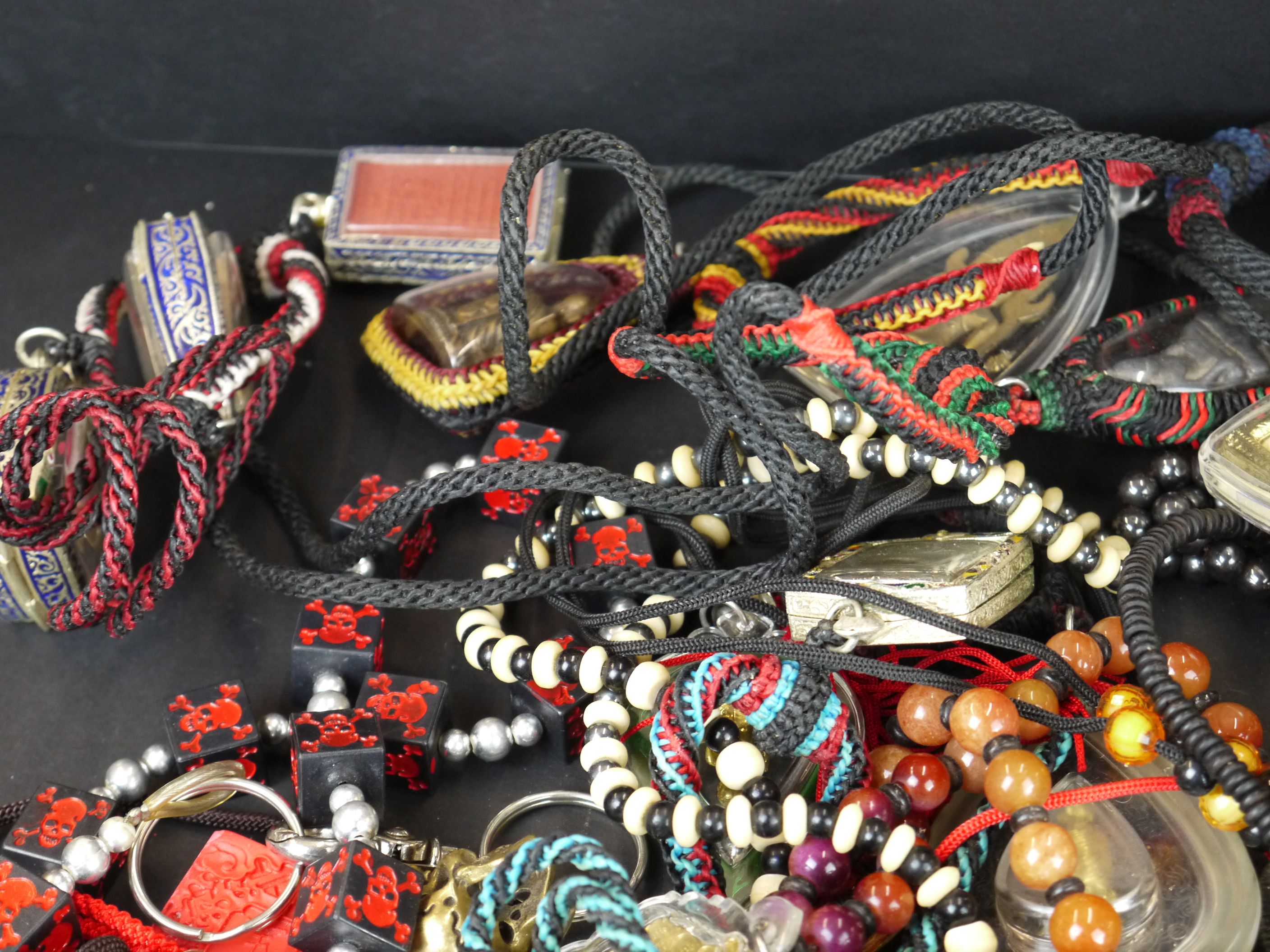 A large collection of oriental strung amulets . - Image 3 of 6