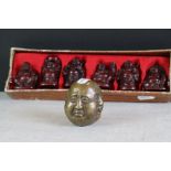 A collection of six Chinese figures of Buddha together with a bronze four faced buddha with