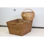 Large Wicker Log Basket, 65cm x 60cm together with a Wicker Single Handle Basket of oval shape, 52cm