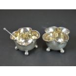 A pair of fully hallmarked sterling silver salts and spoons.