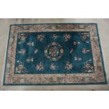 Chinese Green Ground Rug with floral pattern within a cream border, 280cm x 185cm