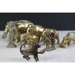 A small collection of brass ornaments to include elephants and tribal examples.