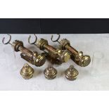 Three Brass ' GWR ' Wall Mounted Railway Carriage Oil Lamps, two with the glass chimneys, 27cm high