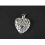 Silver heart shaped perfume bottle