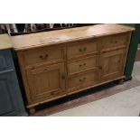 Pine Dresser Base in the 19th century manner comprising an arrangement of five drawers and two