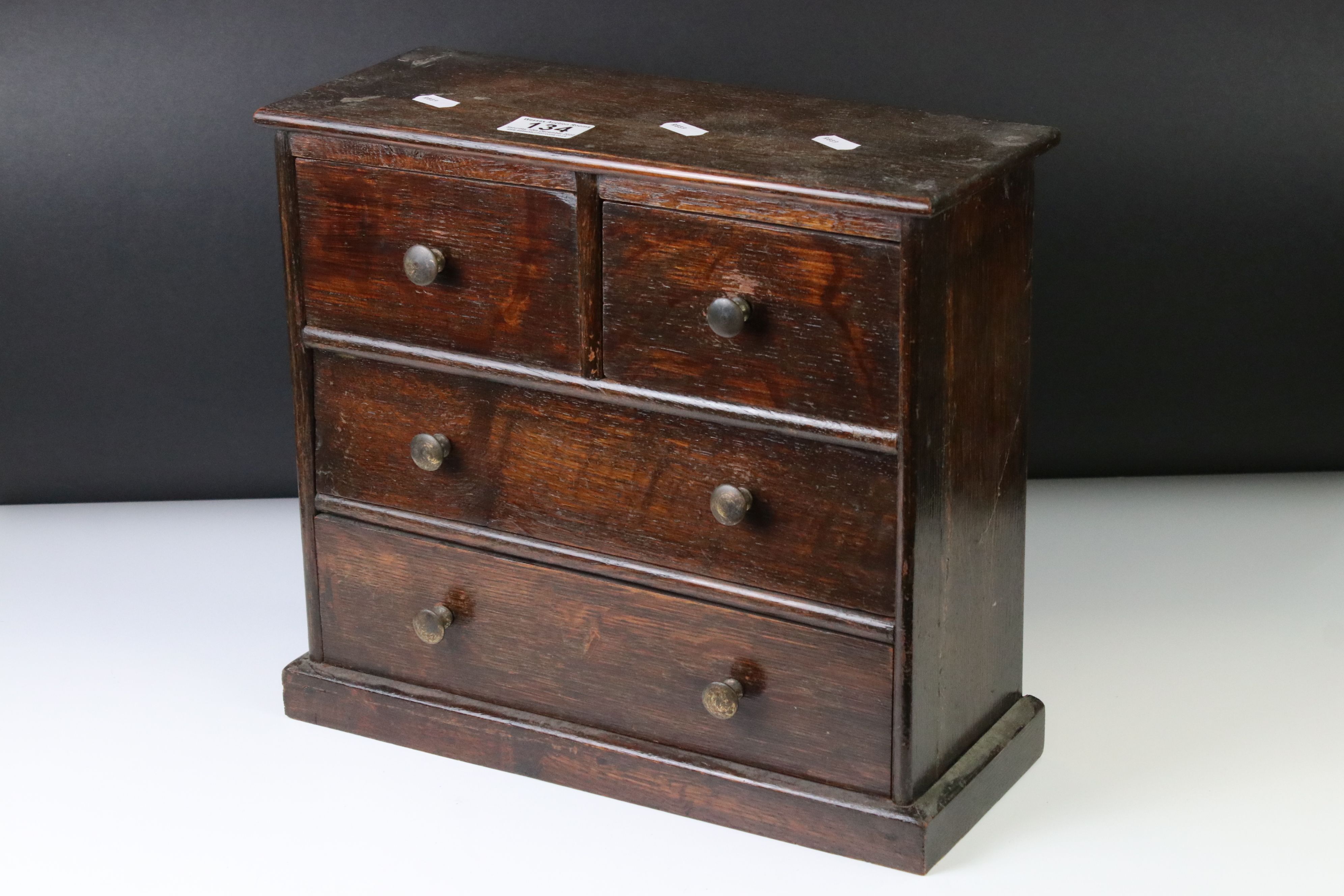 Late 19th / early 20th century miniature oak chest of drawers apprentice piece, with two short