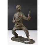 Bronze figure of karate sensei Toru Takamizawa (1942-1998) in a karate fighting pose, dressed in a