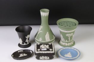 Group of Wedgwood Jasperware to include a green ground tapering vase with removable flower frog,