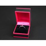 18ct white gold ruby and diamond ring of 75 points total weight