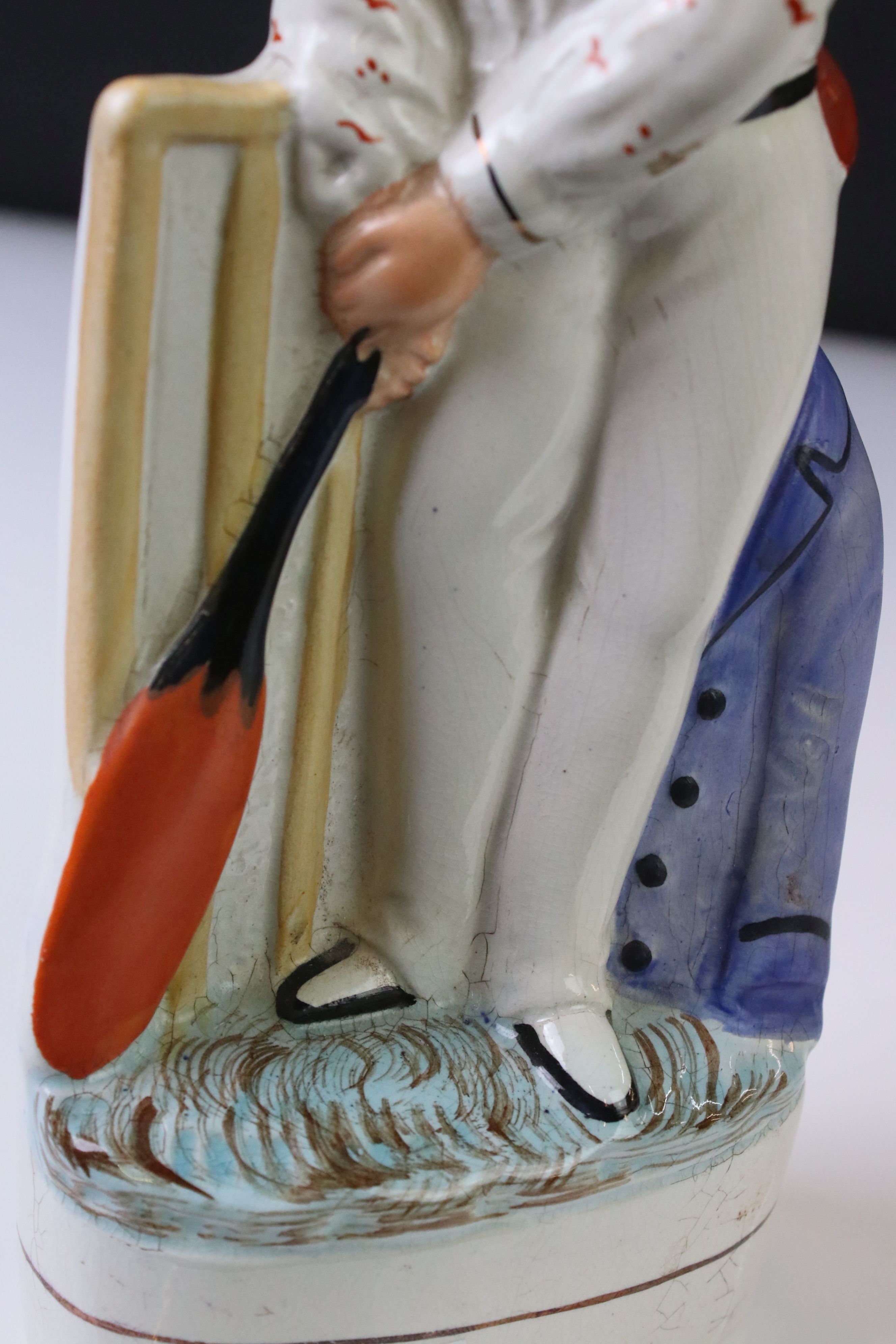 19th Century Staffordshire figure of a batsman wearing an orange cap, a cream spotted shirt, holding - Image 5 of 5