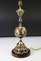 Moorcroft Hibiscus pattern ceramic and brass table lamp with spherical ceramic mid-section, and a