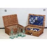 Two Wicker Picnic Hampers, one fitted with plates, cups, thermos and cutlery, 60cm x 40cm, the other