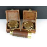 Two contemporary antique style brass compasses housed within wooden boxes together with a three