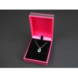 18ct white gold emerald and diamond pendant necklace, 72 points total weight