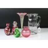 Five items of coloured glassware to include a cranberry overlaid glass bottle with matched silver