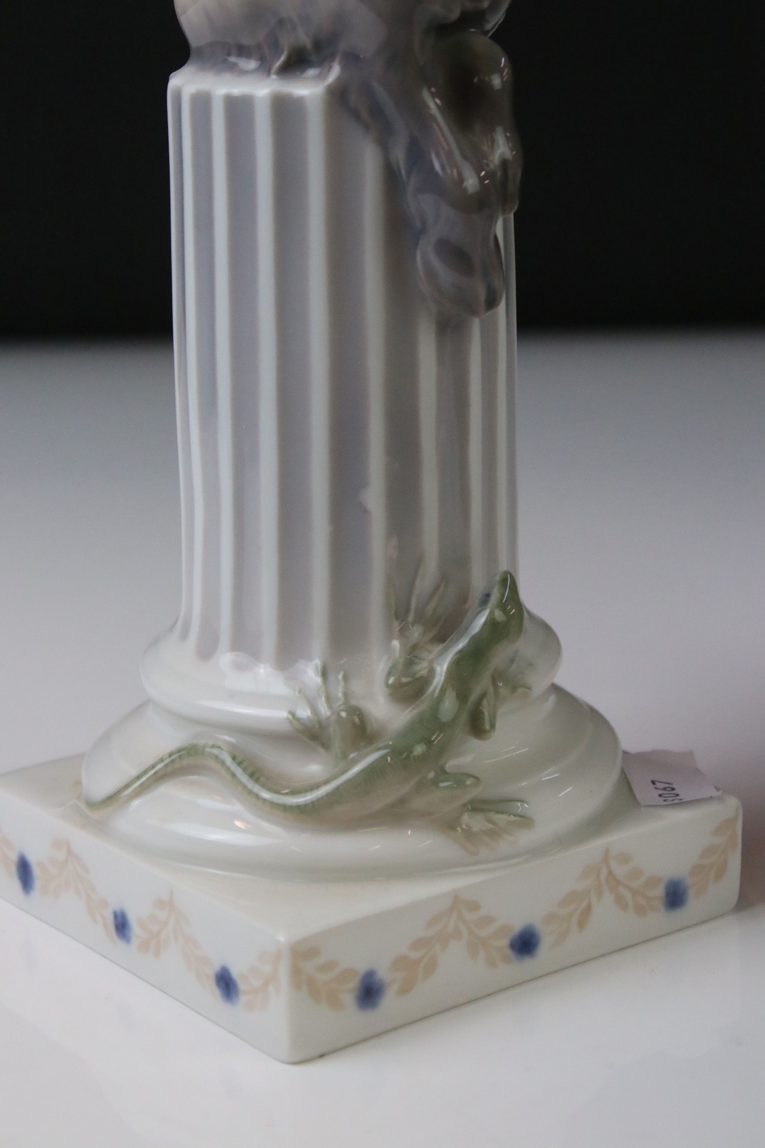 Two Royal Copenhagen porcelain figures to include a faun playing a mouth organ seated on fluted - Image 3 of 9