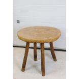 Rustic Polished Elm Circular Table, the top made from a single slice of trunk, raised on four turned