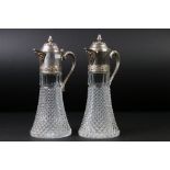 Near pair of silver plated and moulded glass claret jugs with hobnail effect decoration, the
