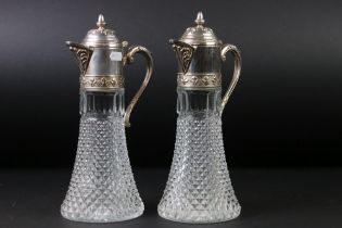 Near pair of silver plated and moulded glass claret jugs with hobnail effect decoration, the