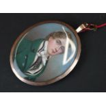 Early 19th century portrait miniature of a gentleman wearing a green coat with silver buttons, the