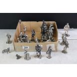 A collection of over twenty Royal Hampshire silver plated figures to include Blacksmith, paper