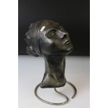Averil Leah - Ceramic sculpture of a lady's head, the lady with headband and flowing hair, mounted