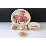 Five pieces of Moorcroft Magnolia pattern pottery to include a plate (26cm diameter - signed WM),