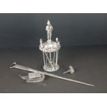 A silver plated cocktail stick holder with scalloped ends and a piper finial together with a meat