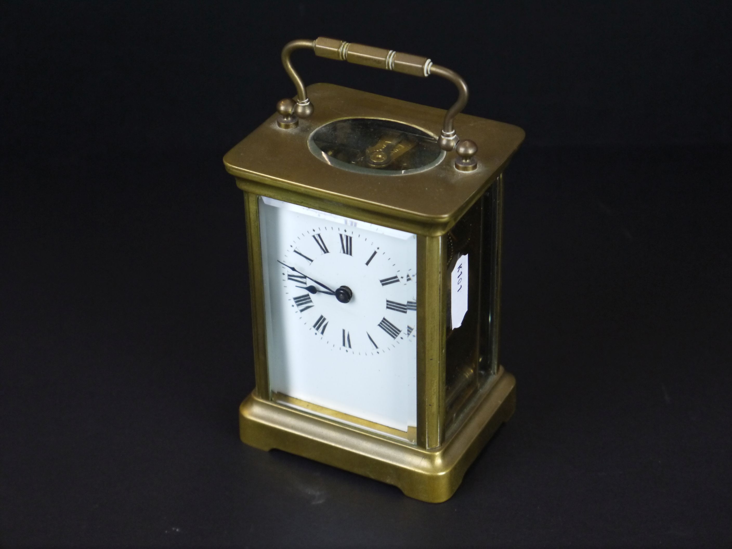 An early 20th century brass cased carriage clock with bevelled glass panels and white enamel dial. - Image 4 of 4