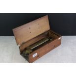 An antique wooden cased music box.