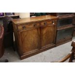 19th century Mahogany Side Cabinet with two drawers over two cupboard doors, raised on a plinth