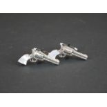 Pair of silver pistol cufflinks with mother-of-pearl handles