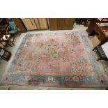 Large Chinese Carpet, pink and blue ground with a floral pattern, 410cm x 309cm