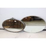 Two Early to Mid 20th century Oval Wall Mirrors, one with grapes and vines metal finial, largest