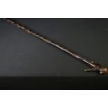 20th century tribal style carved wooden walking stick with figural two-faced handle; snake, animal