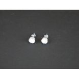 Pair of silver and opal stud earrings